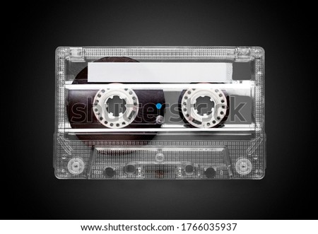 Retro old cassette on a black background.