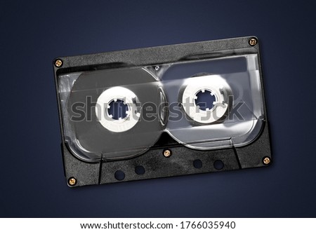 Retro old cassette on a dark background.