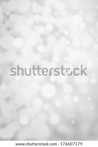 Grey Lights Festive background. Abstract Christmas twinkled bright background with bokeh defocused silver lights