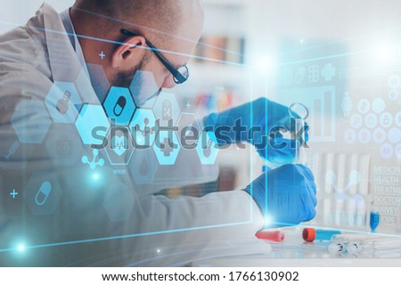 Man researcher carrying out scientific research in a lab Royalty-Free Stock Photo #1766130902