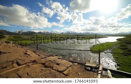 Mountain river. Beautiful summer mountain landscape. Suusamyr Valley, Kyrgyzstan