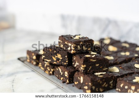 Homemade chocolate brownie with cashew nut and almonds Royalty-Free Stock Photo #1766158148