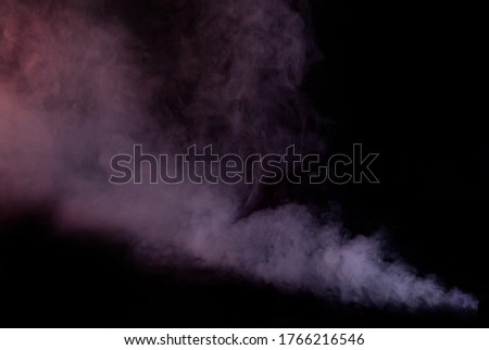 White smoke on a black background. Colored smoke with a blue and red tinge. The texture of scattered smoke. Blank for design. Layout for collages.