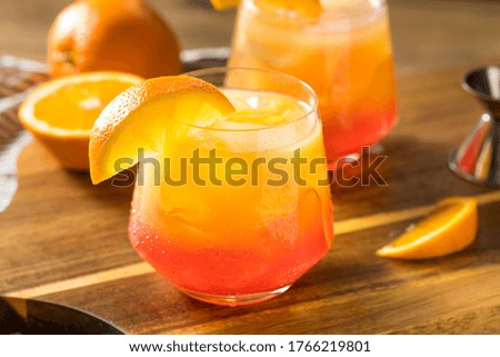 Boozy Refreshing Tequila Sunrise Cocktail with Grenadine Royalty-Free Stock Photo #1766219801