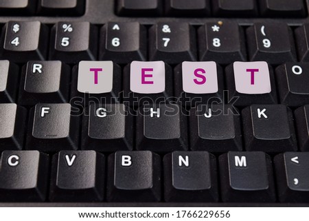 Test write on keyboard isolated on laptop background