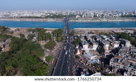Aerial view of Ahmedabad,Gujarat/India. Riverfront and garden with skyline buildings drone view landscape. Post coronavirus covid-19 city reopens. social distancing rules after city restrictions ease. Royalty-Free Stock Photo #1766250734