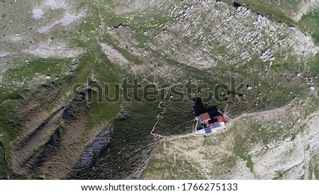 Aerial drone photo from iconic of shelter camp near lake Drakolimni of Tymfi mountain which resides at high altitude above sea, Vikos National Park, Zagori, Greece