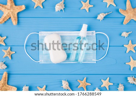 Be saved on vacation keep social distance concept. Top above overhead close up view photo of antiseptic spray white hand bar soap and face mask with seashell starfish isolated color bright backgr