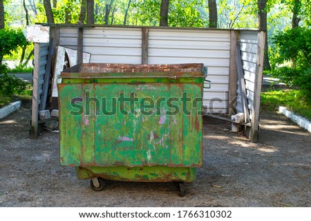 selective focus. Green Drummed Waste Container. place for garbage disposal. environmental protection concept garbage collection. copy space.