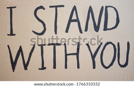 I STAY WITH YOU. Text message for protest on cardboard. Stop racism. Police violence. Banner. Design concept.