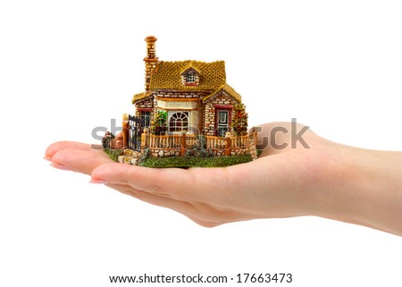 Hand and house isolated on white background