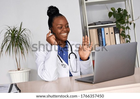 African female doctor talk with patient make telemedicine online webcam video call. Black woman therapist videoconferencing on computer in remote telemedicine laptop virtual chat. Telehealth concept Royalty-Free Stock Photo #1766357450