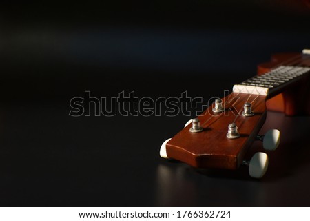Closeup of the pegs of a ukulele