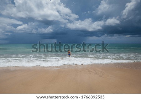 Happy female woman enjoying sunny day on the tropical caribbean sandy beach landscape with turquoise sea and blue sky. Freedom concept 