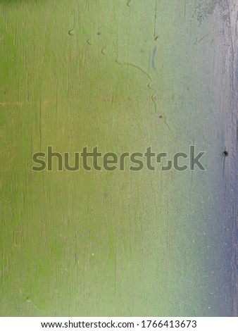 beautiful wooden surface in green with a blue stripe with a dot to the right