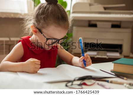 
Left-handed. International left-handed day. Girl in glasses for sight. A girl writes in a notebook with her left hand. Education and science. Preschool education. Royalty-Free Stock Photo #1766425439