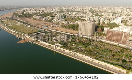 Aerial view of Ahmedabad,Gujarat,India. Riverfront and garden with skyline buildings drone view landscape. Post coronavirus covid-19 city reopens. social distancing rules after city restrictions ease. Royalty-Free Stock Photo #1766454182