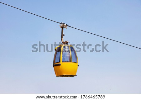 cable car on a partly cloudy blue sky background Royalty-Free Stock Photo #1766465789