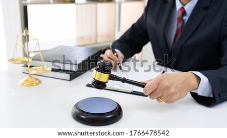 Professional Secretary lawyer working at his office signing contract Consultation of client from trust Law Firm, Attorneys Notary Law and Legal services concept.