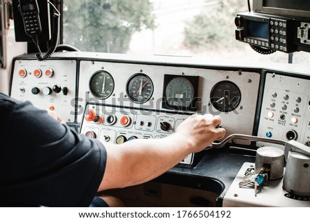 A comeng electric train in Melbourne australia, inside controls being driven by a train driver Royalty-Free Stock Photo #1766504192