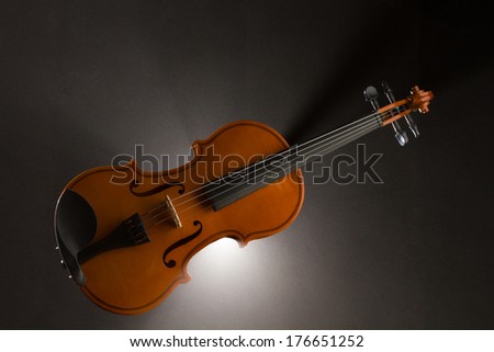 violin with smoke over dark background- selective focus