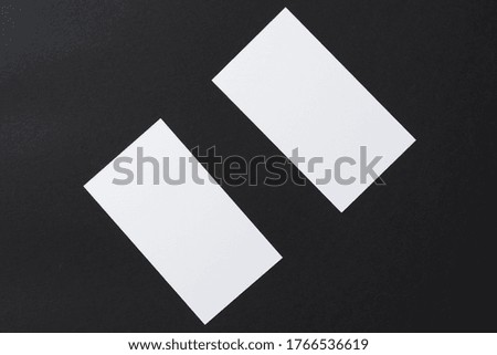 White blank business cards on dark black background