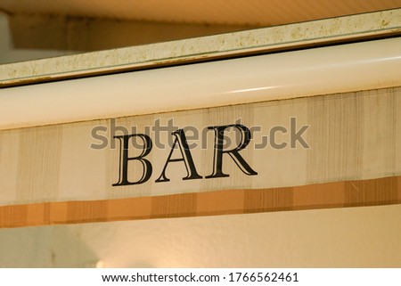 text bar on front building cafe pub in street