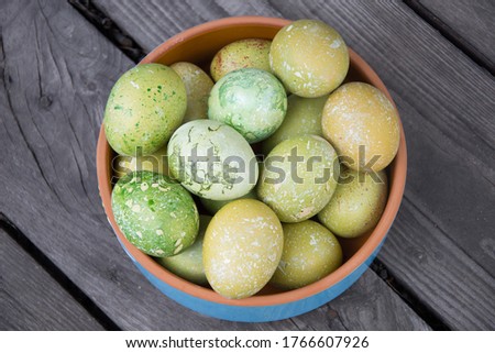 Decorated easter eggs in the glass bowl