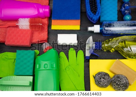 Household goods for dry cleaning and cleaning. On a wooden background.