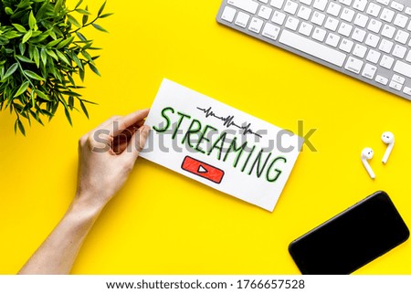 Streaming video concept - tablet on office workplace. Top view