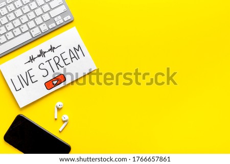 Streaming video concept - tablet on office workplace. Top view
