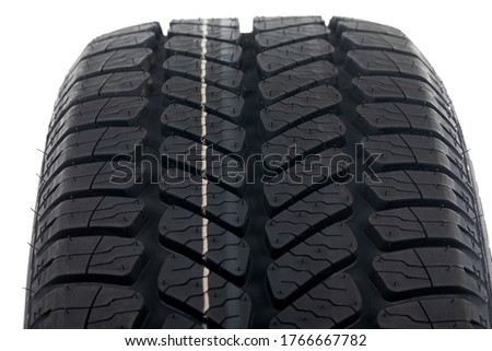 Close up picture of brand new black automobile tyre 