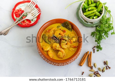 Traditional Indian Curried Shrimp in a Pot with Spices and Cilantro Top View Horizontal Photo Royalty-Free Stock Photo #1766713181