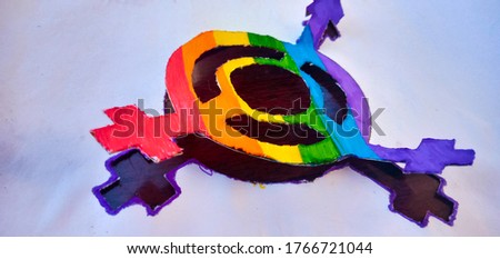 Draw LGBT logo handmade using rainbow colored paper and markers