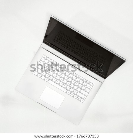 High angle image of gray color laptop personal computer on white background