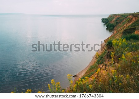 Beautiful panorama with dramatic sky overlooking the sea and sand cliffs