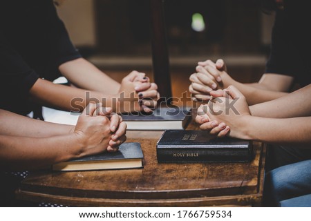 Christian family worship God in home with holy bible on wooden table Royalty-Free Stock Photo #1766759534