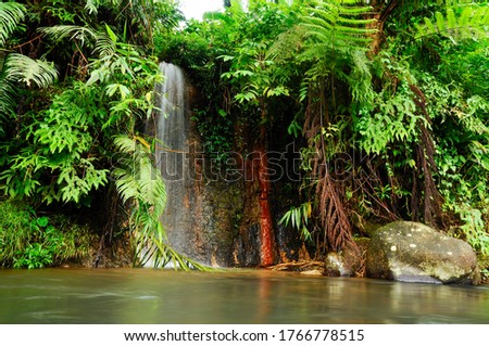 Beautiful Tropical waterfall "Curug Pangeran" on the Natural park of the Mount Salak in West Java, Indonesia Royalty-Free Stock Photo #1766778515