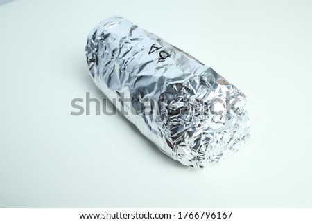 isolated image burrito wrap in aluminium foil. Royalty-Free Stock Photo #1766796167