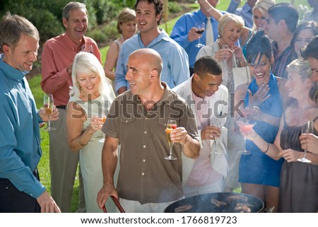 A group of people at a summer barbeque