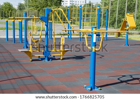 Urban outdoor sports ground with weight training equipment for sports. Sports and recreation area. Royalty-Free Stock Photo #1766825705