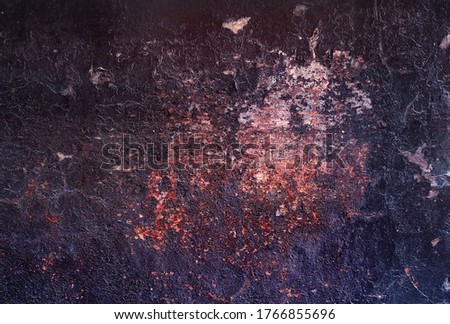 grunge wall background with shelling texture - black and red scratched and cracked surface for a dark wallpaper