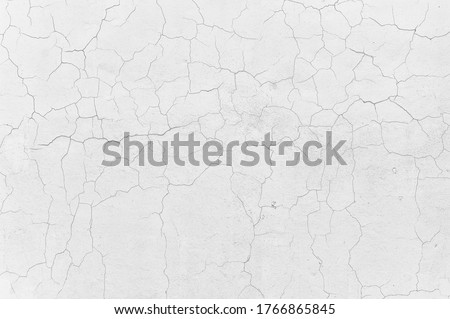 Crack white concrete wall ,Damaged Cement wall textured background