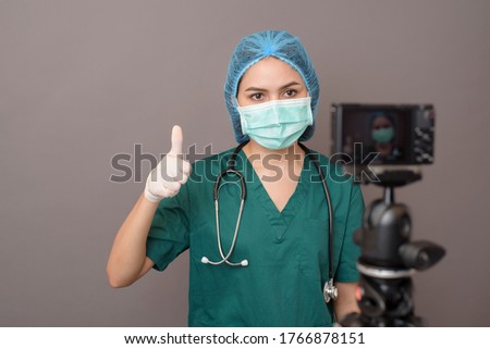 Behind the scenes of young doctor in front of camera in studio, film production studio Royalty-Free Stock Photo #1766878151
