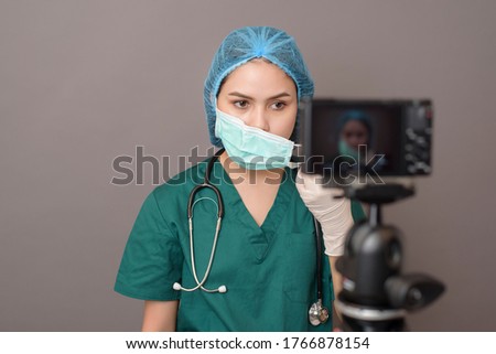 Behind the scenes of young doctor in front of camera in studio, film production studio Royalty-Free Stock Photo #1766878154