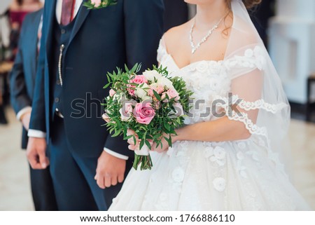 Wedding bouquet with pink roses for bride and groom at an event celebration