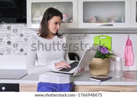 Young woman working in home office using laptop, business woman, teacher, mentor, consultant, manager talking, looking at computer webcam, video conference call. Remote work, lifestyle, freelance