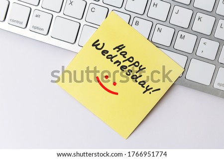 Happy Wednesday text on yellow paper note stick on computer keyboard Royalty-Free Stock Photo #1766951774