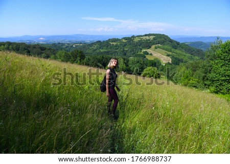 Girl outdoors enjoying nature on the field
