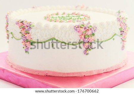 Details of birthday cake isolated on white background. 